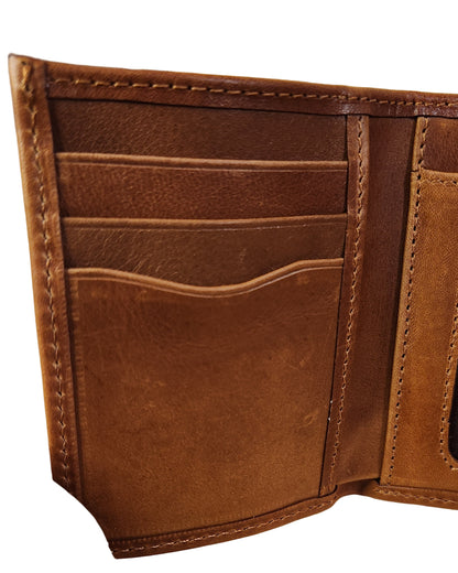 Brown leather wallet on a beige background