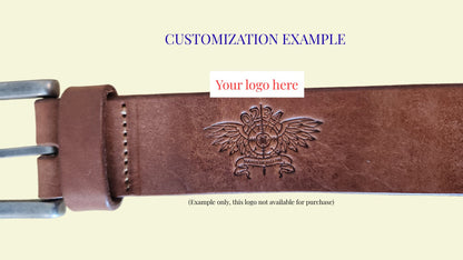 Brown leather belt with an embossed design on a beige background