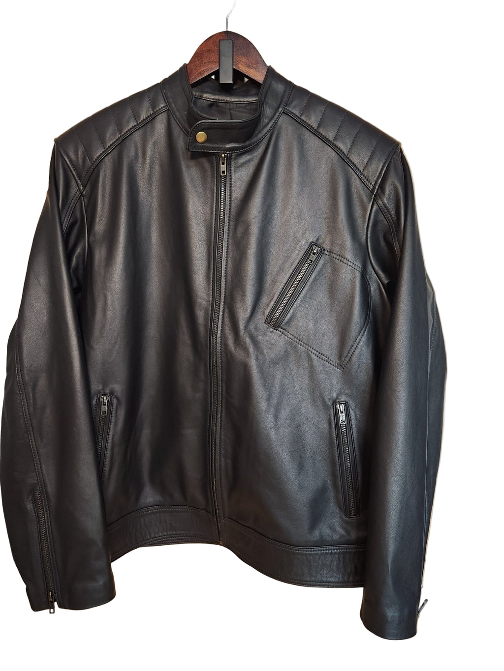 Black leather jacket on a wooden surface