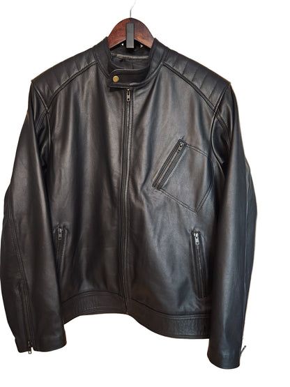 Black leather jacket on a wooden surface