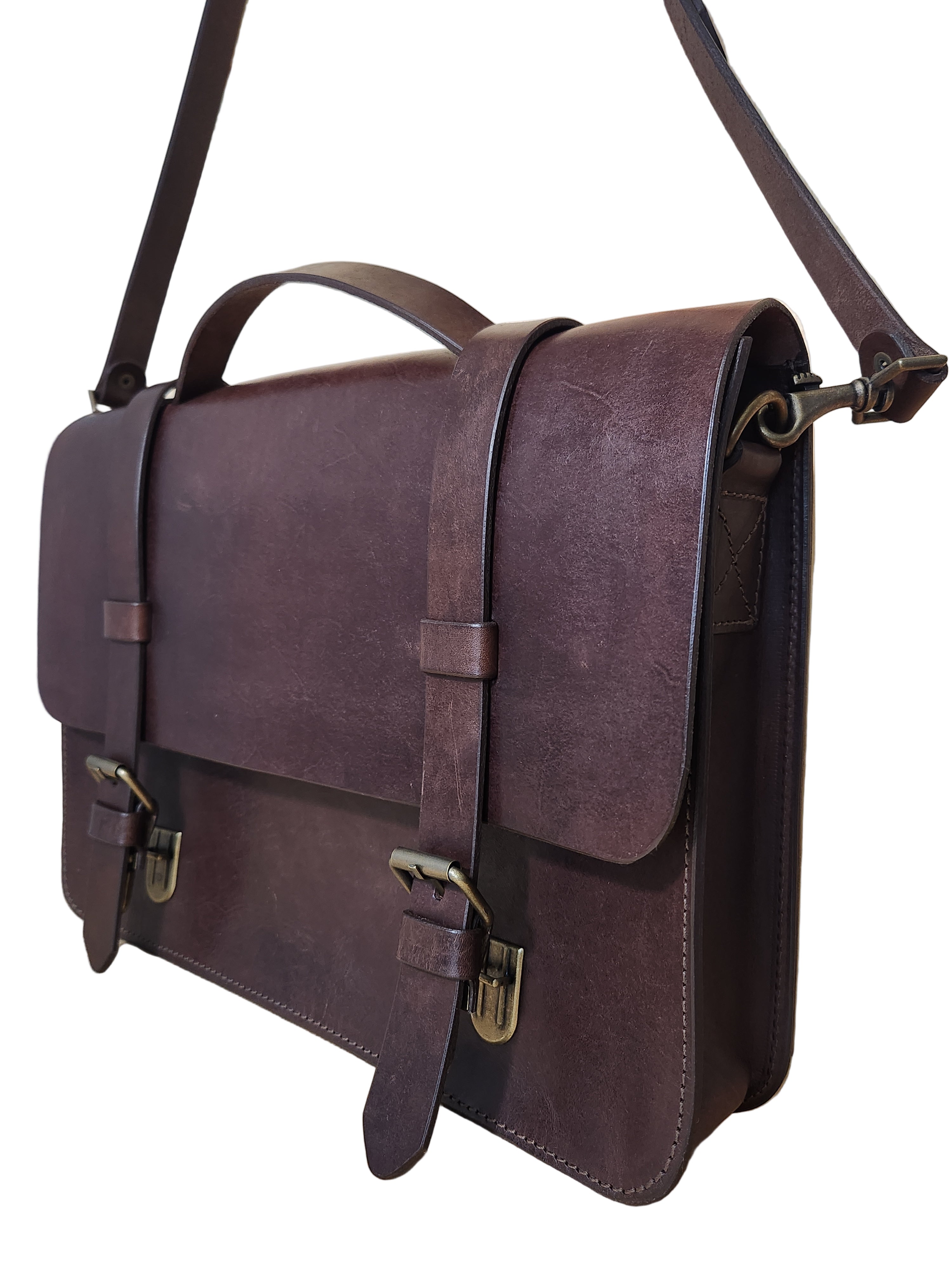 Brown leather bag on a wooden surface