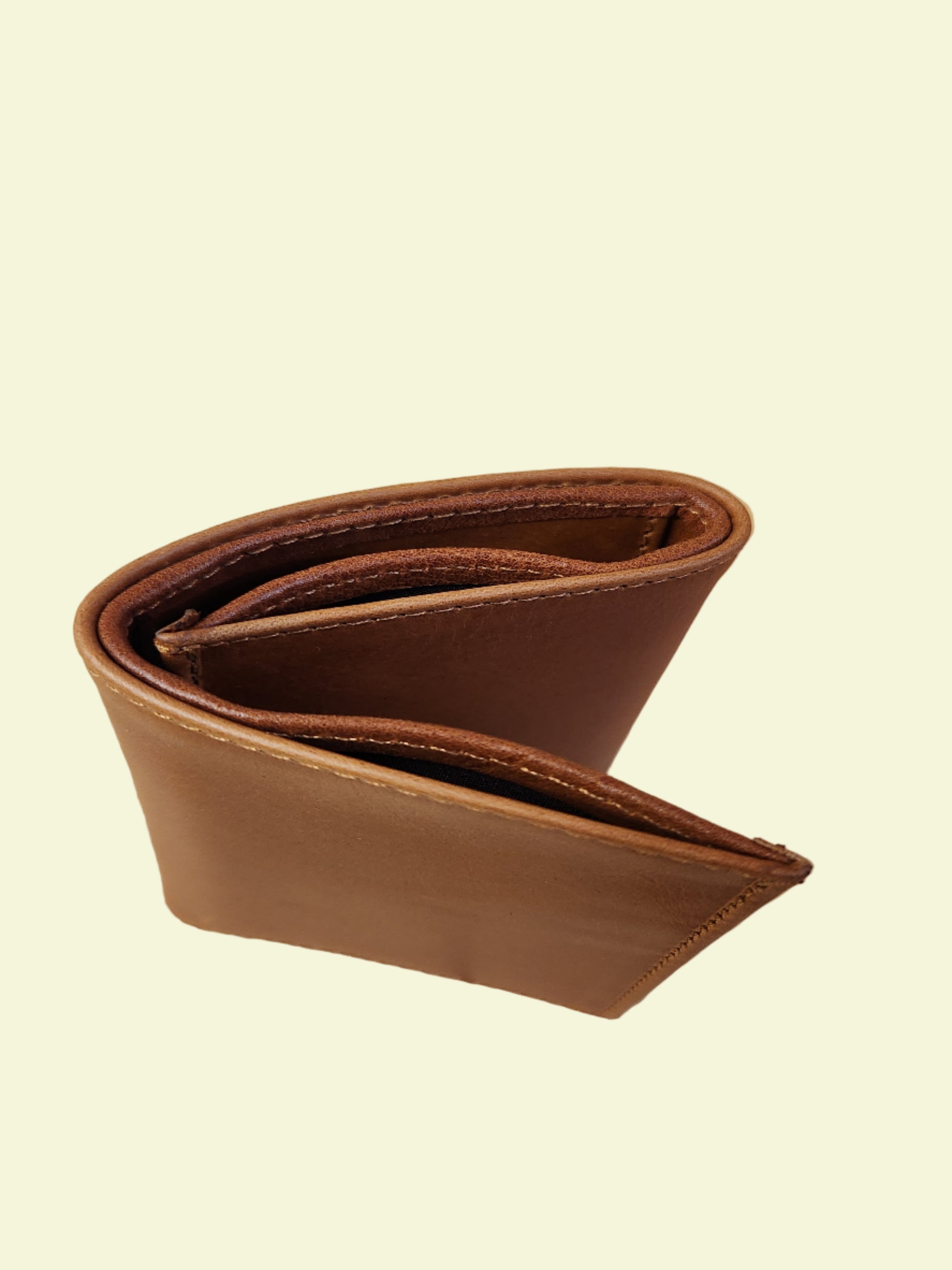 Brown leather wallet on a wooden surface