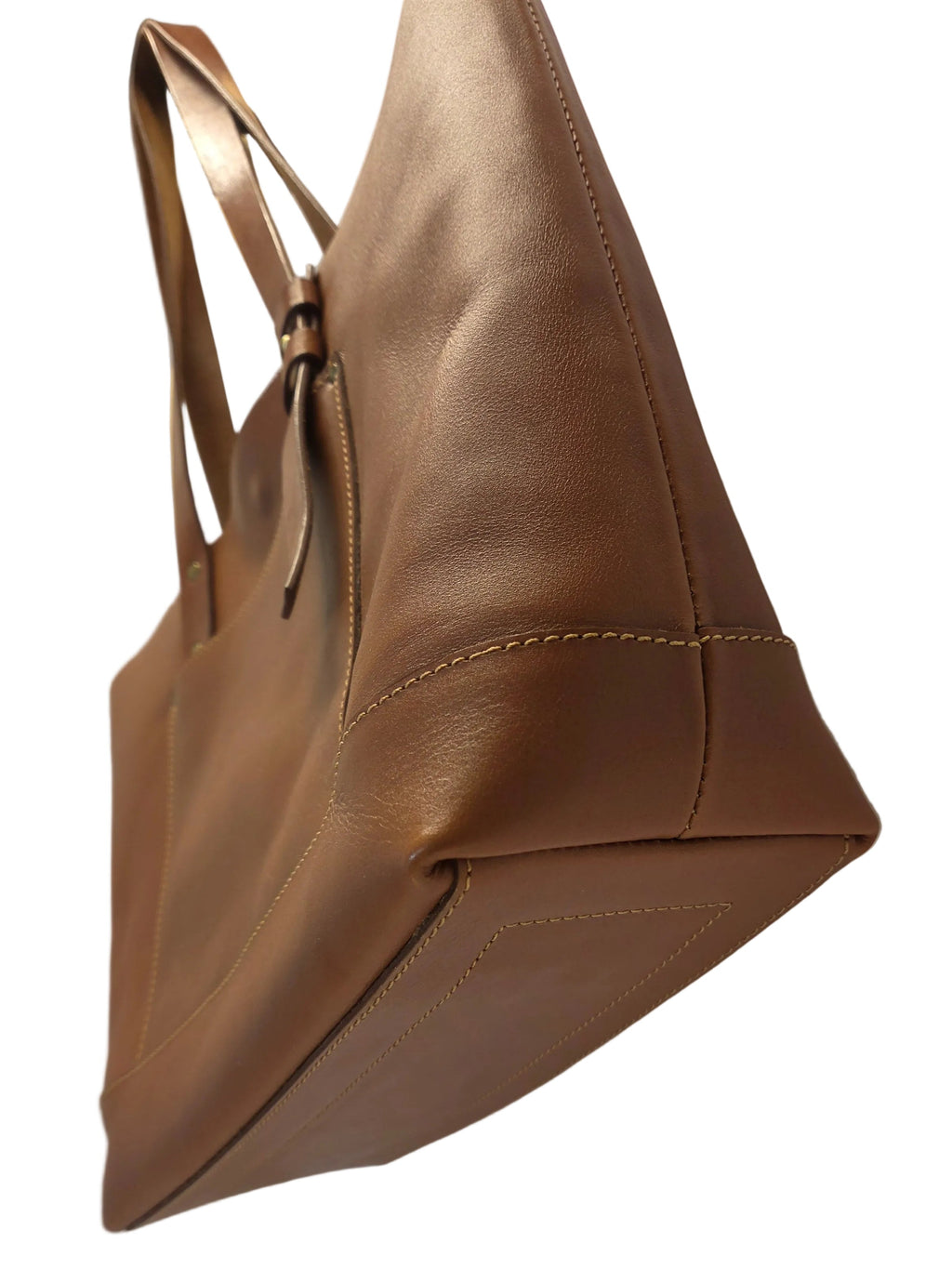 Brown leather bag with a gold zipper on a neutral background