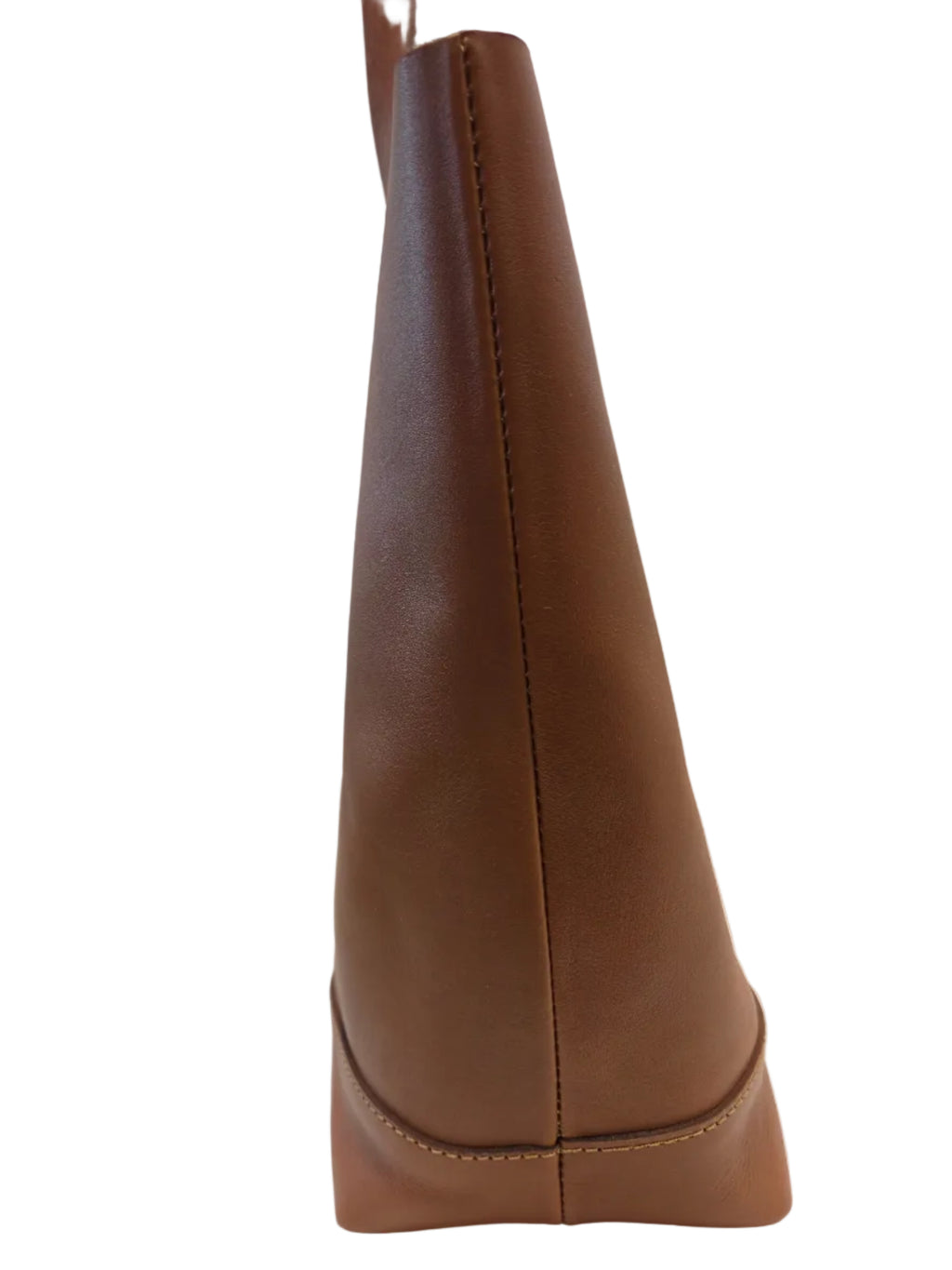 Close-up of a brown leather handle on a white surface