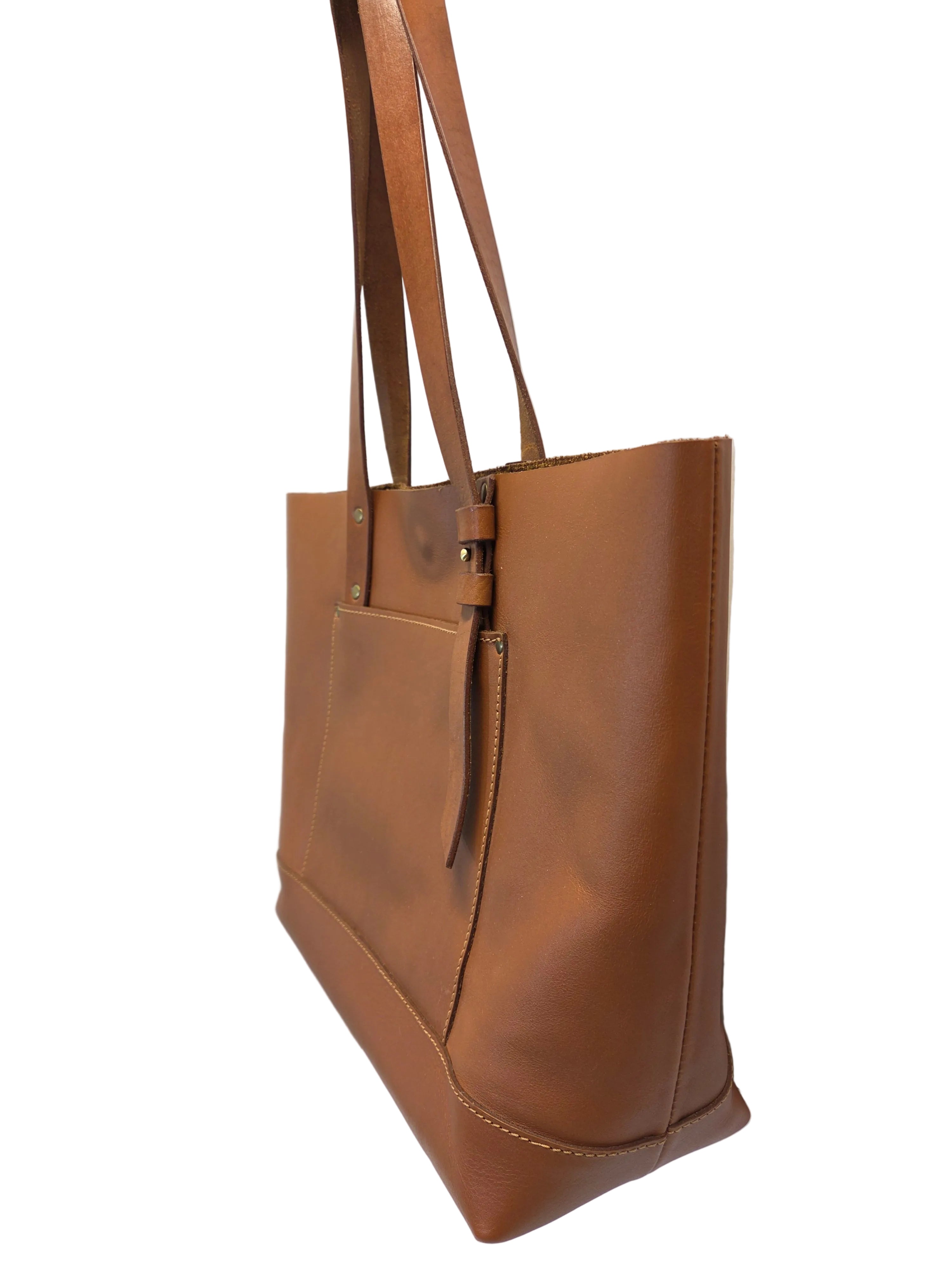 Brown leather handbag on a light gray background