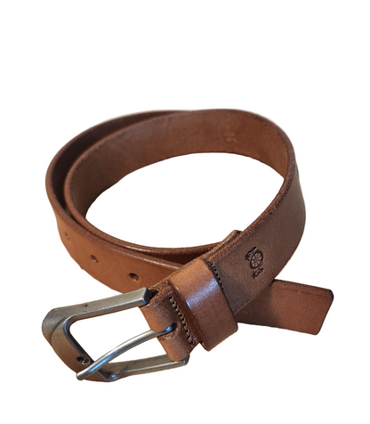 Brown leather belt with silver buckle on a beige background