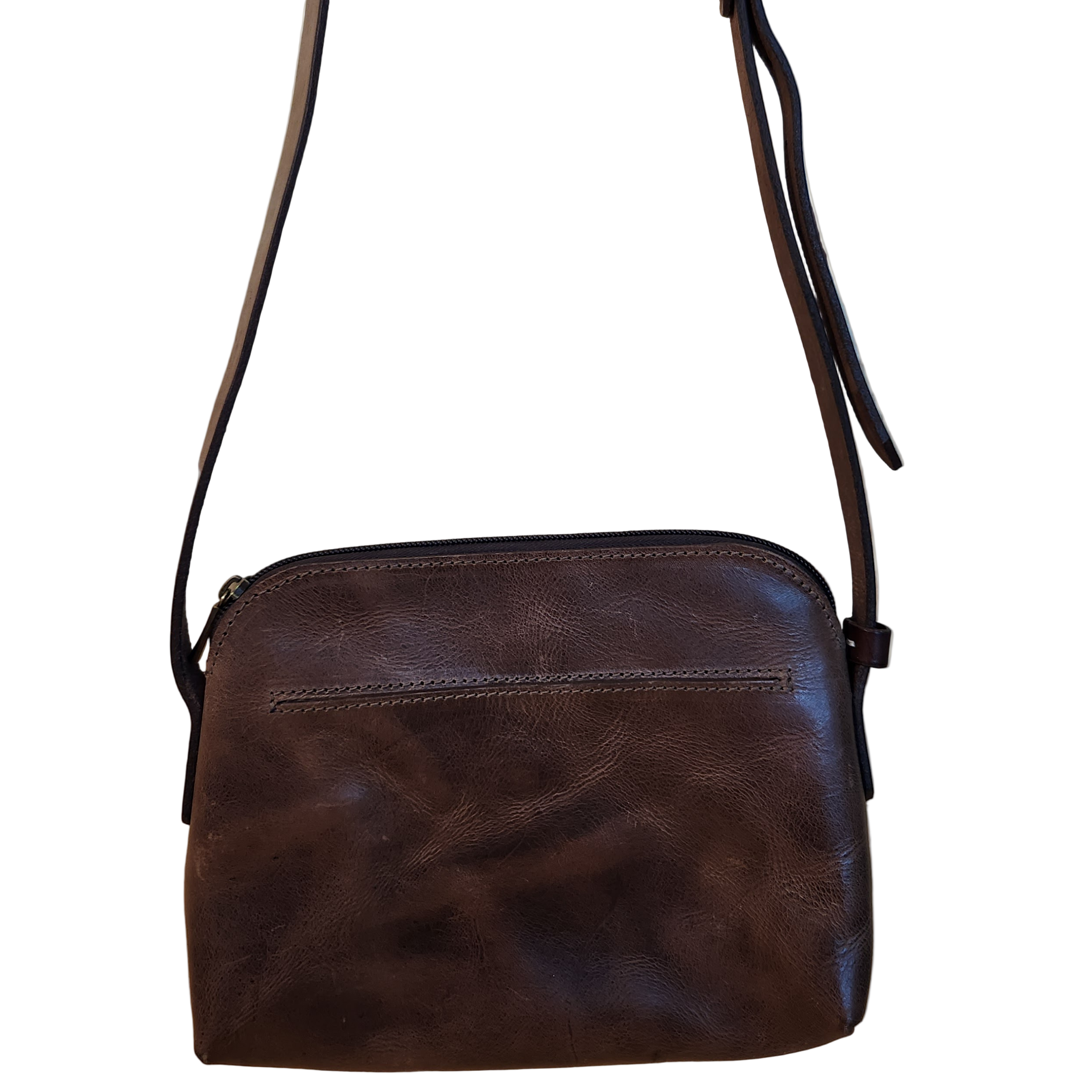 Brown leather crossbody bag on a beige background