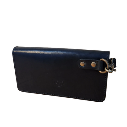 Black leather wallet with a keychain on a wooden surface