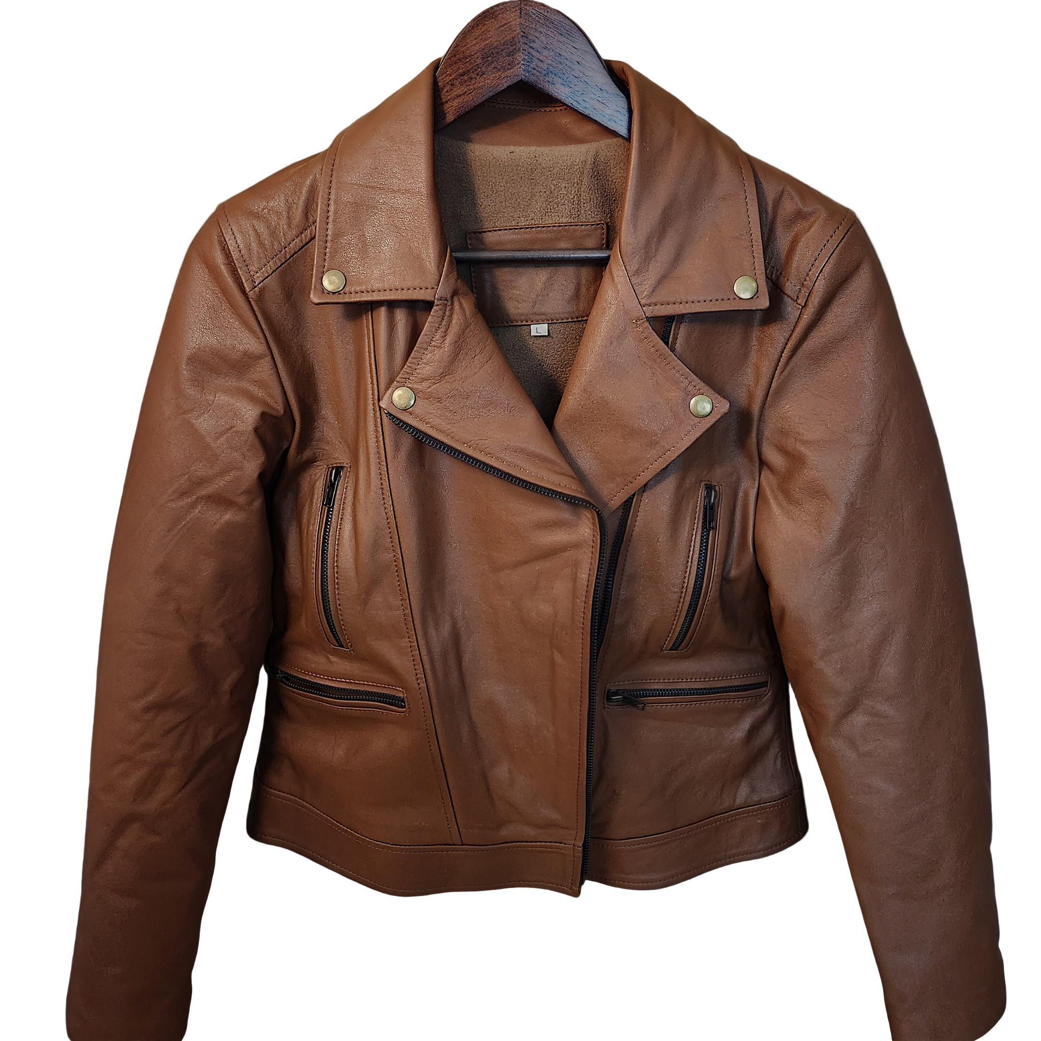 Brown leather jacket on a hanger against a wooden background with autumn leaves.