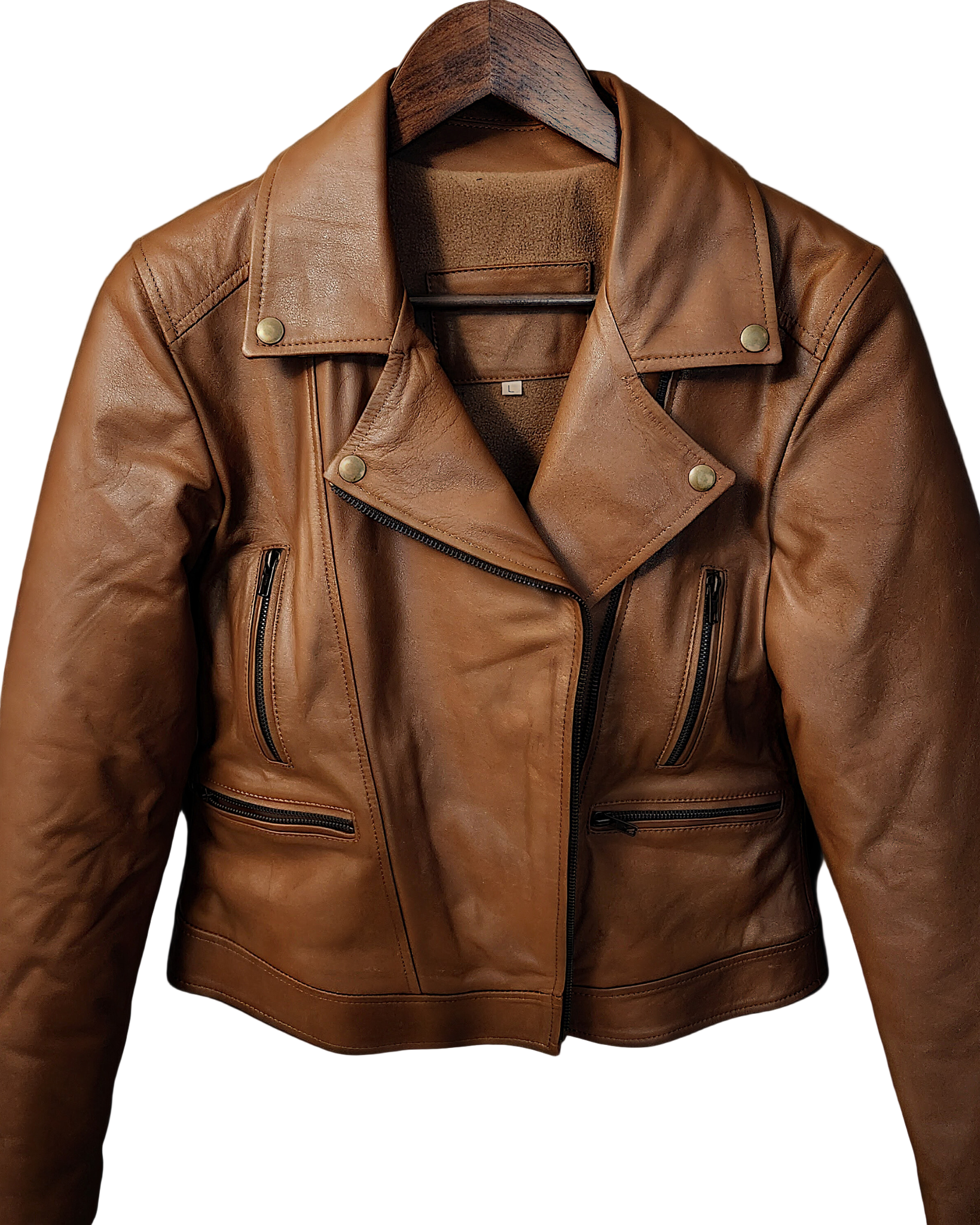 Brown leather jacket on a hanger against a wooden background with autumn leaves.