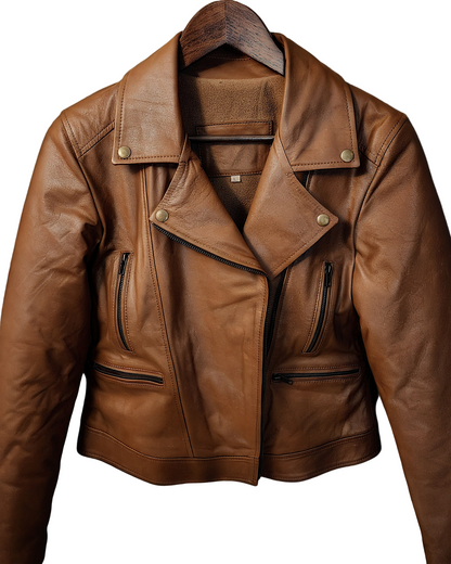 Brown leather jacket on a hanger against a wooden background with autumn leaves.