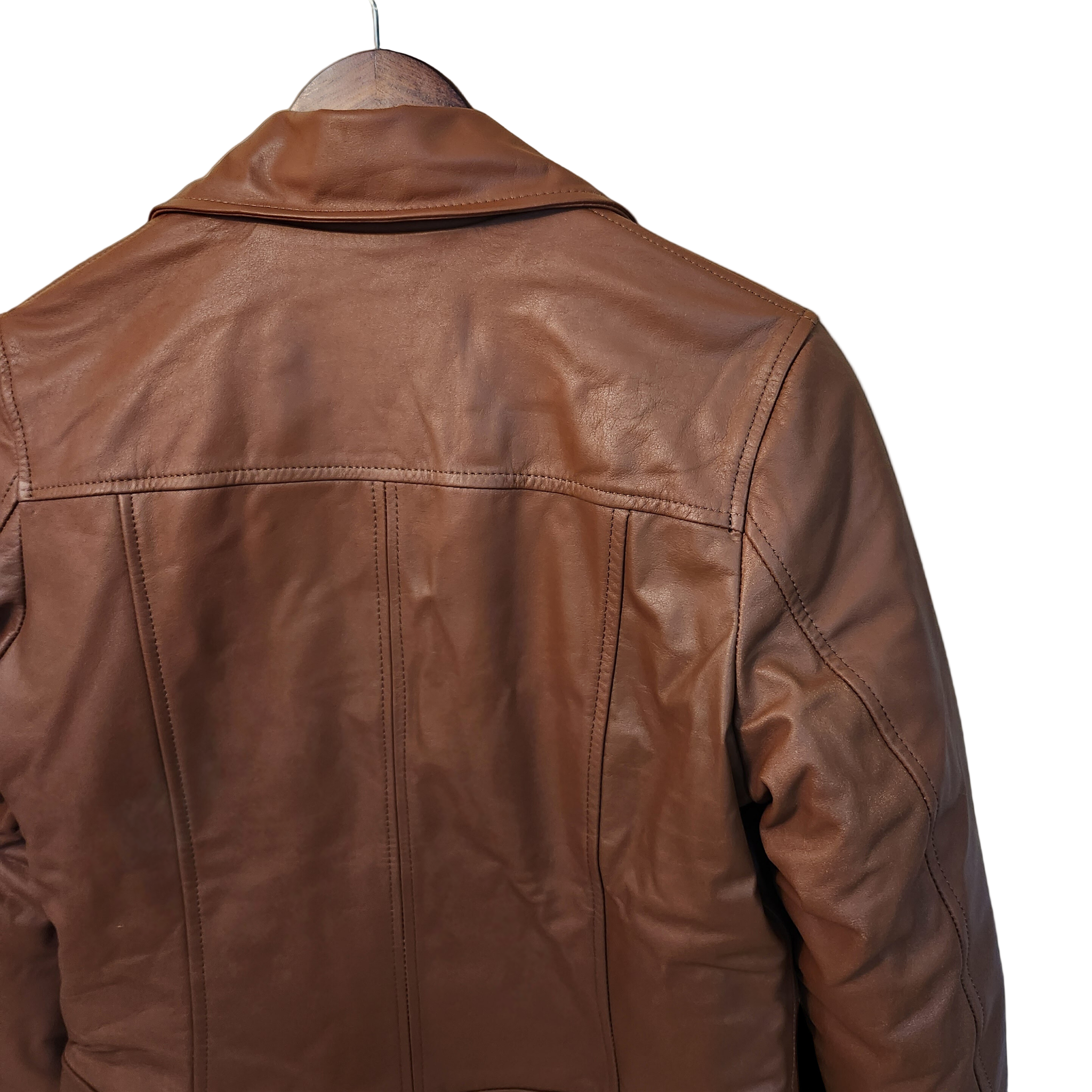 Brown leather jacket on a wooden background