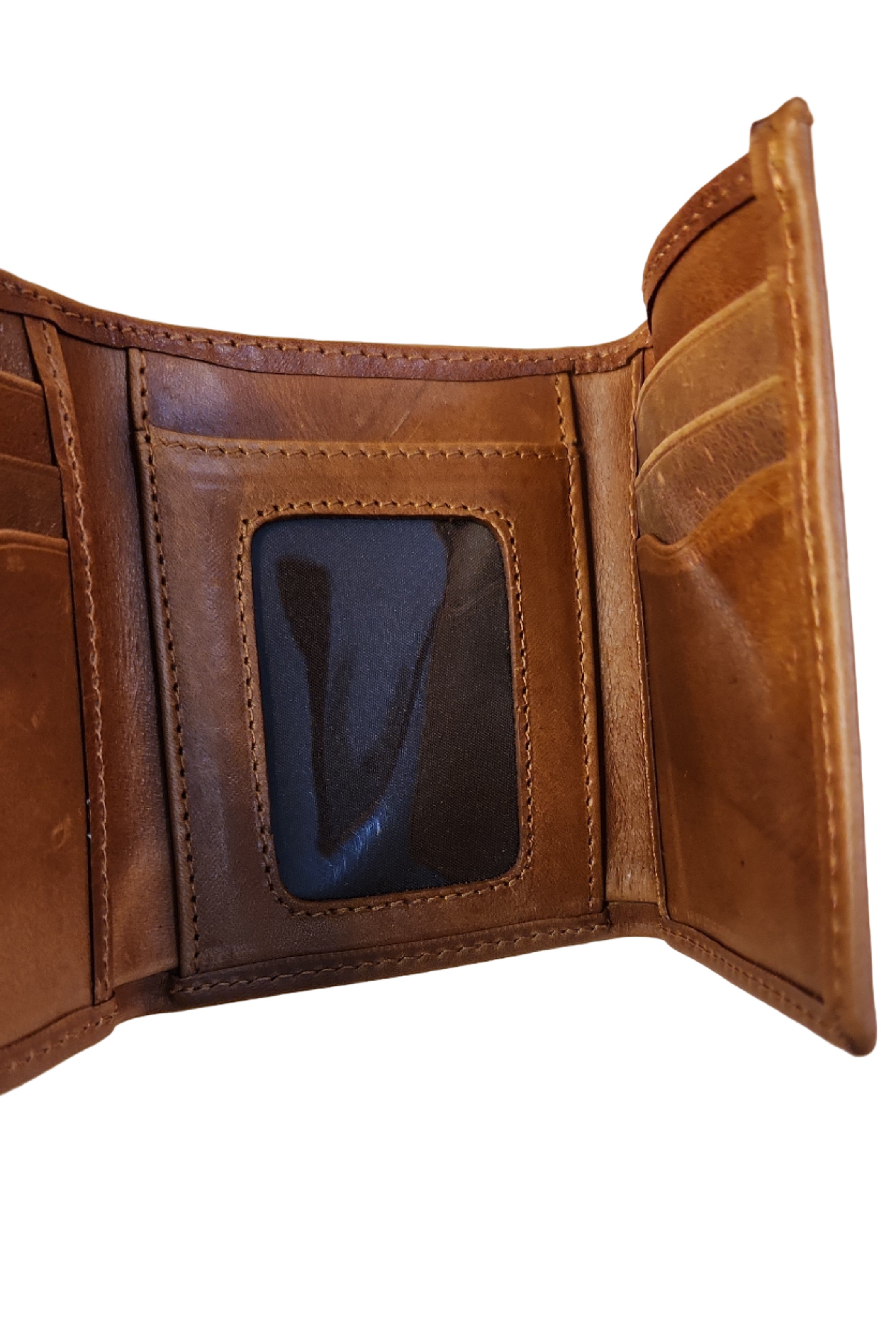 Brown leather wallet open on a wooden surface