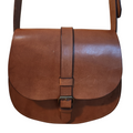 Brown leather satchel bag on a wooden surface