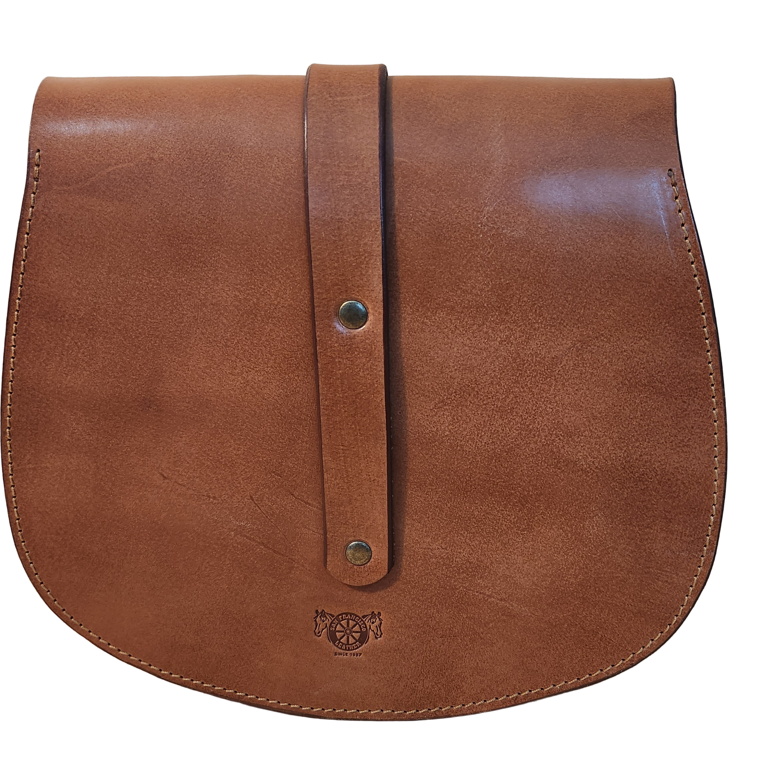 Brown leather bag with strap on a wooden surface