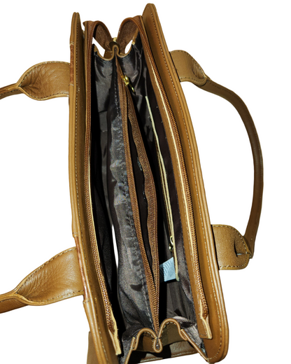 Brown leather handbag on a wooden surface