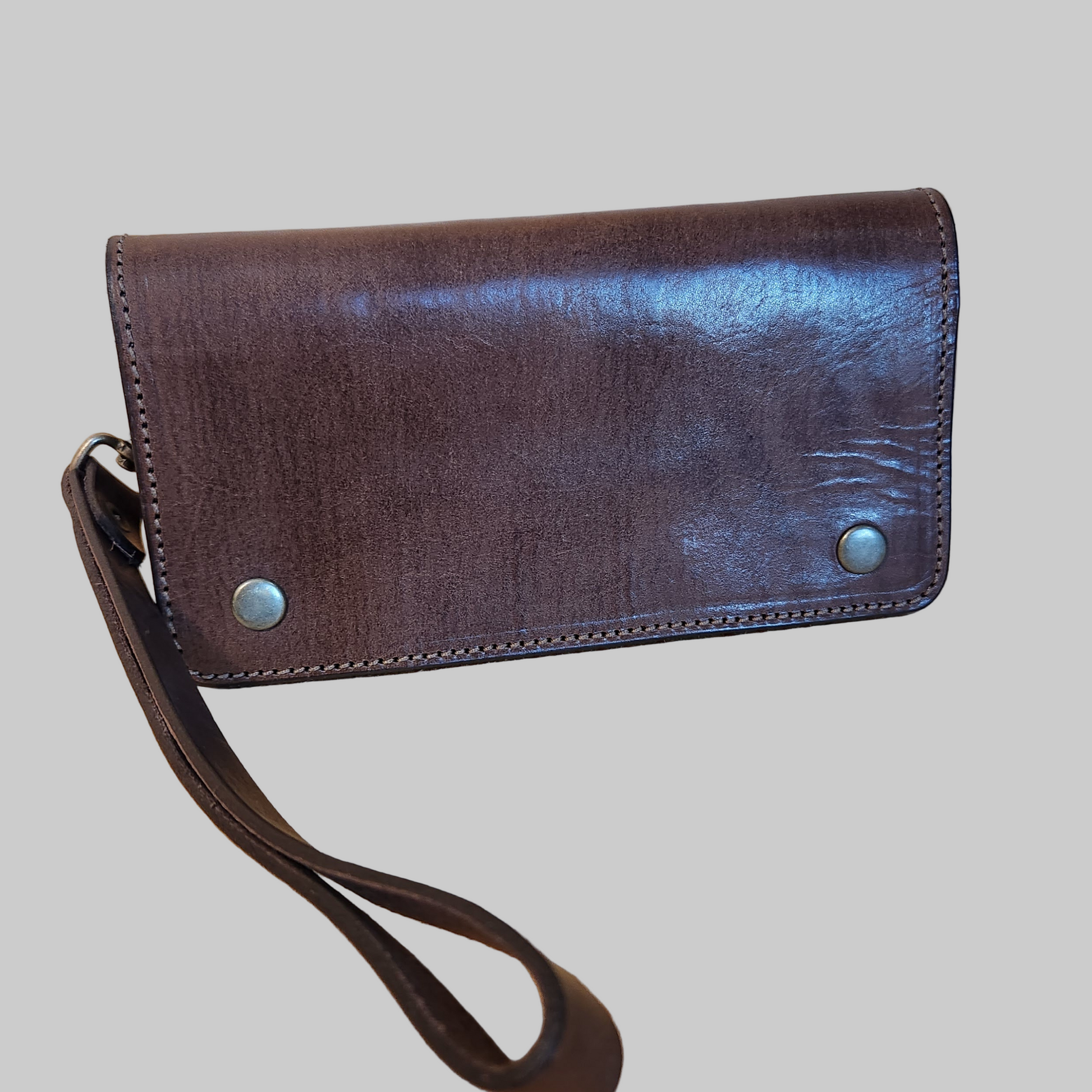Brown leather wallet with a strap