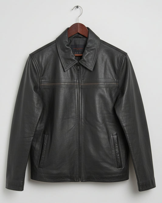 Black leather jacket on a wooden surface