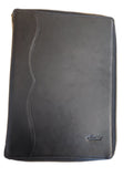 Black leather case on a wooden surface