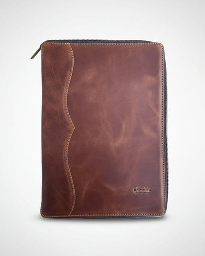 Brown leather pouch on a wooden surface